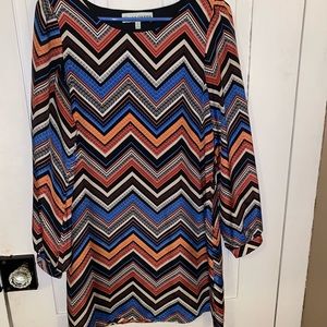 Long sleeve thigh length dress.